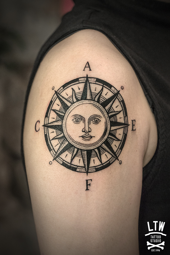 Compass tattooed by Alexis in Black and grey