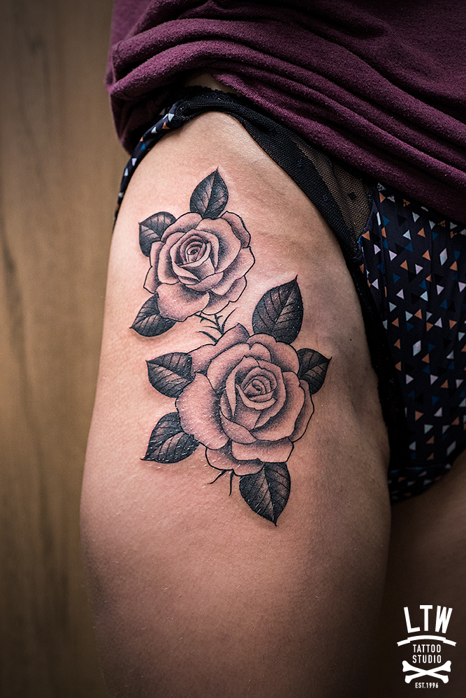 Black and grey roses tattooed by Alexis