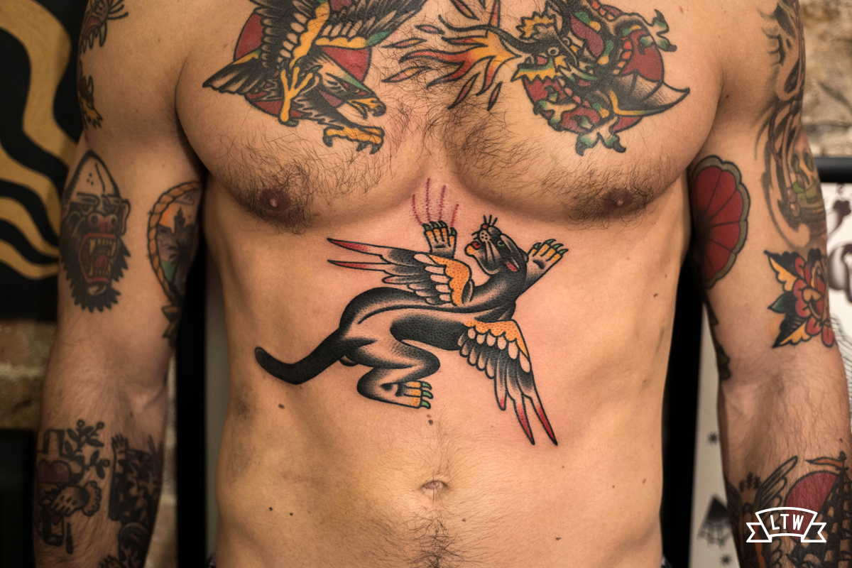 Panther with wings tattooed by Javier Rodríguez