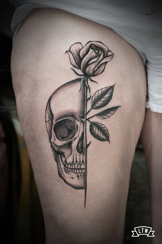 Skull and rose tattooed by Dani Cobra
