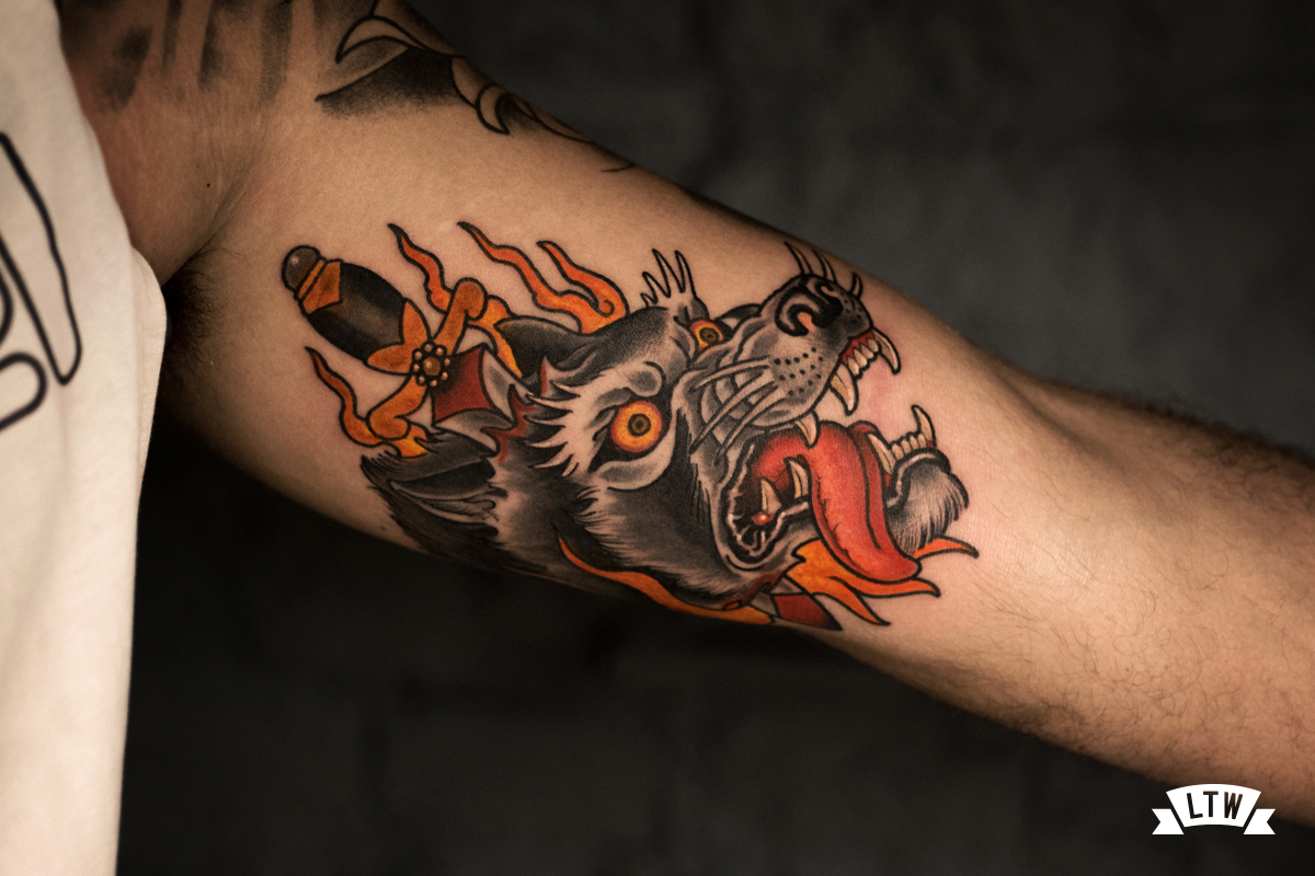 Wolf head tattoo done by Rafa Serrano
