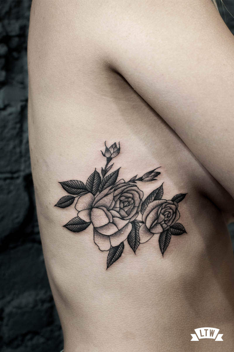 Black and grey roses tattooed by Dani Cobra