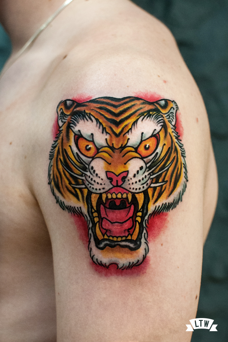 Tiger head tattooed by Rafa Serrano