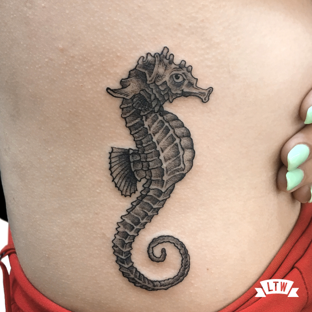 Sea horse tattooed by Andrés Poján in black and grey style