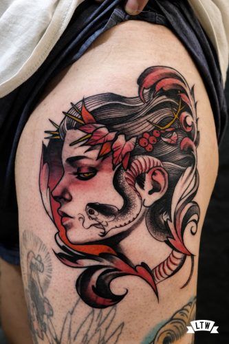 Woman and snake tattooed in color by Man
