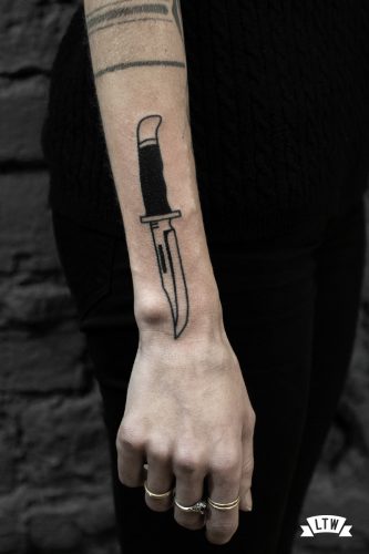 Knife tattooed in black and white by Ese Black