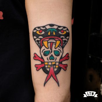 Cobra with skull traditional style tattooed by Javier Rodríguez
