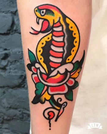 Cobra with rose traditional style tattooed by Javier Rodriguez
