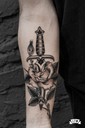 Dagger with rose tattooed by Miquel