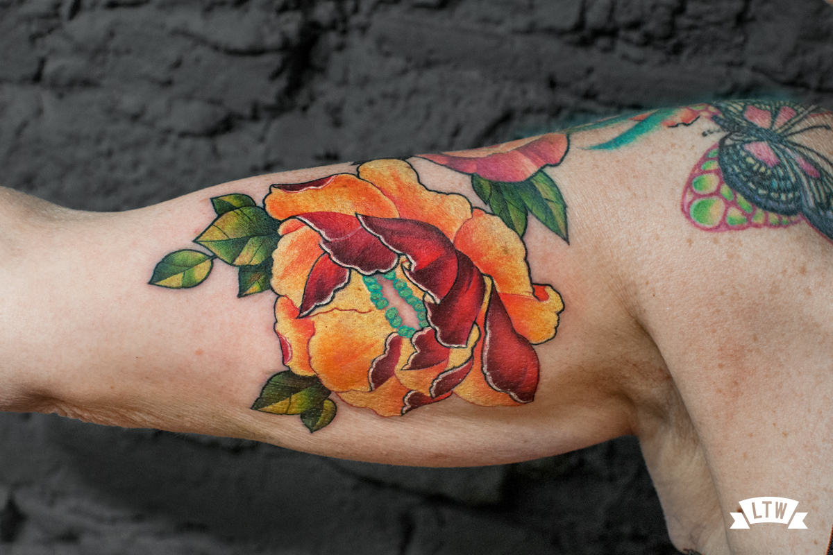 Flower tattooed in color by Jon Pall