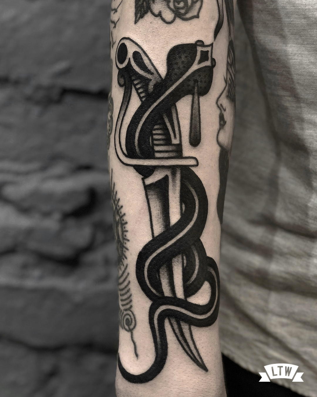 Dagger and cobra Tattooed by Dennis